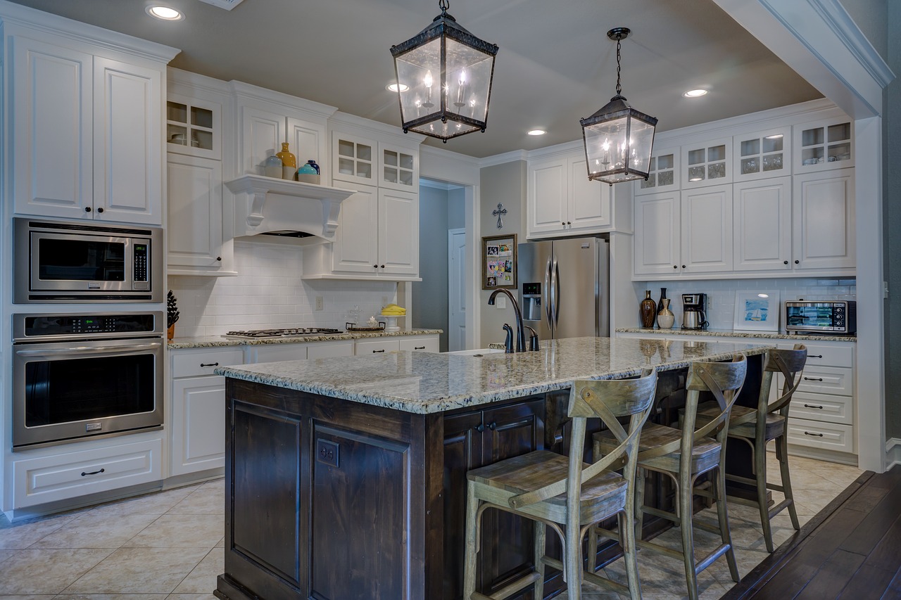 Stylish high-end kitchen with granite countertops.